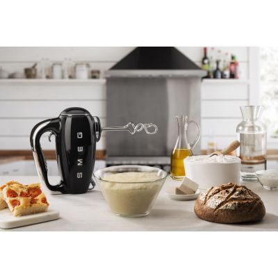 3. Smeg HMF01BLEU hand mixer in a retro 1950s style.