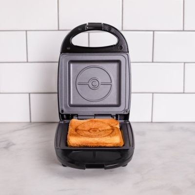 7. Uncanny Brands Pokémon Poké Ball Toaster Black, Red, White