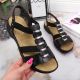 4. Black leather Roman sandals Rieker W 64580