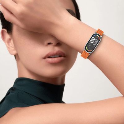 4. Tech-Protect Nylon Pro Strap for Xiaomi Smart Band 8/9/10/NFC - Black and Orange