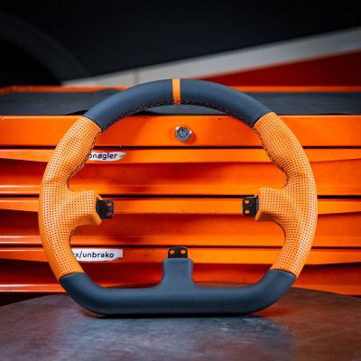 6. Asetek SimSports GT – steering wheel rim – closed D-shape, black and orange
