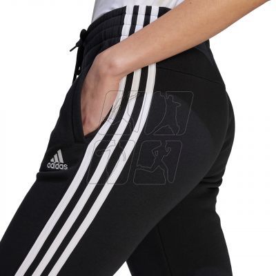 5. adidas Essentials 3-Stripes Fleece W HZ5753 pants