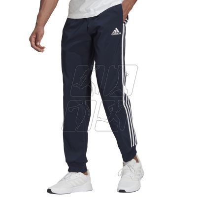 3. Adidas Essentials Tapered Cuff 3 Stripes Pants M GK8981