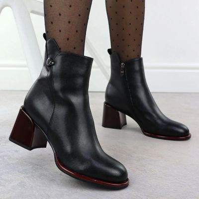 11. Black leather women’s ankle boots with a decorative heel Filippo DBT7363