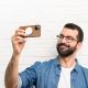 4. Dux Ducis Grit Leather Case for iPhone 14 Plus Elegant Faux Leather Cover (MagSafe Compatible) Brown