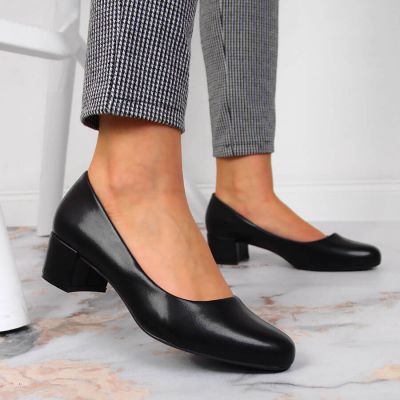 5. Black block heels by Sergio Leone