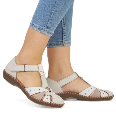 5. Rieker M1655-61 comfortable women's sandals with velcro closure and closed toes in beige