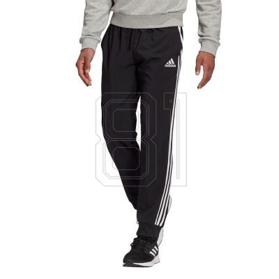 6. Pants adidas Essentials Tapered Cuff 3 Stripes M GK8980