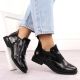 9. Women’s black crocodile-effect patent leather ankle boots with decorative detail, Filippo DBT6425