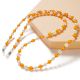 2. A chain for glasses, beads, an orange pendant
