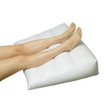 Inflatable orthopedic pillow for legs and back
