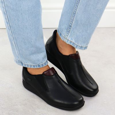 7. Women’s black leather wedge shoes Rieker 47253-00