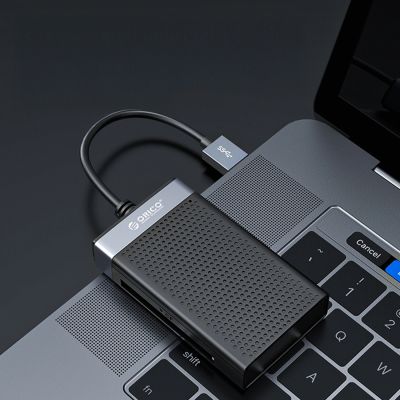 7. Orico CL4D-A3 USB-A 3.0 SD microSD CF MS 5 Gb/s Memory Card Reader - Black and Silver