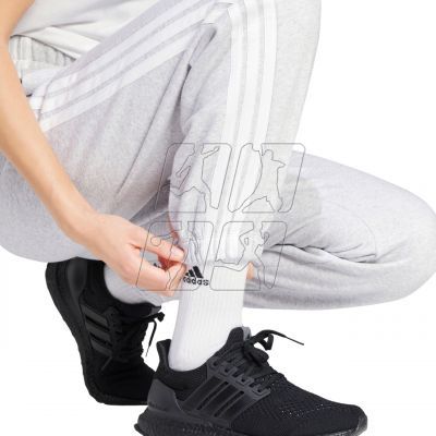 5. adidas Essentials 3-Stripes Fleece Loose-Fit Pants IN6178